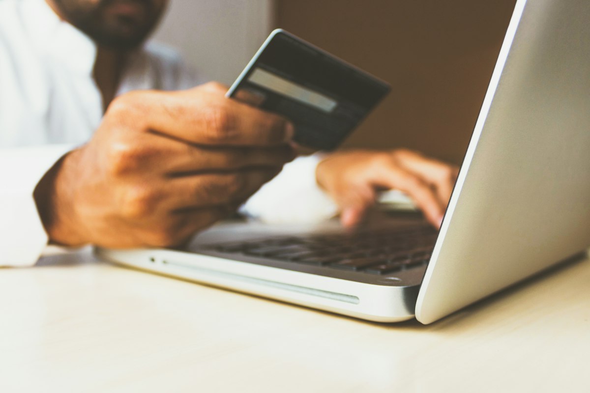 Customer shopping online with a credit card on an ecommerce website