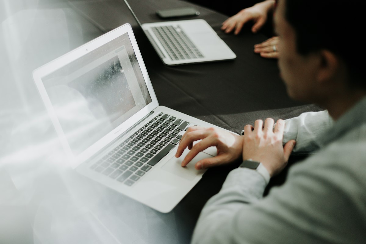 Experienced web developer working on a laptop