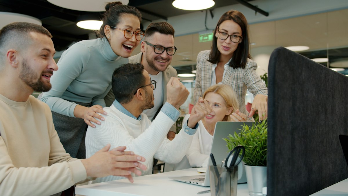 Business team celebrating website growth results