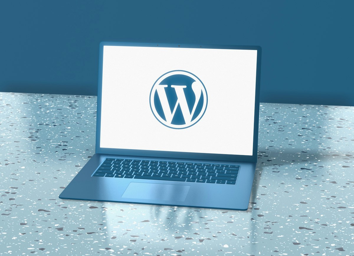 Laptop showing the WordPress logo for WordPress development services